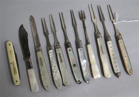 Seven 19th century and later silver and mother of pearl handled travelling forks a similar silver fruit knife and three other items.